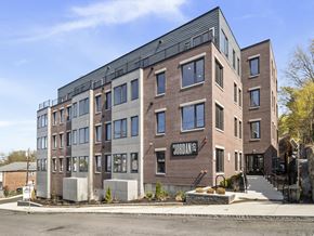 Boston apartment for rent - A modern brick building with the word "Jordan" on the side.
