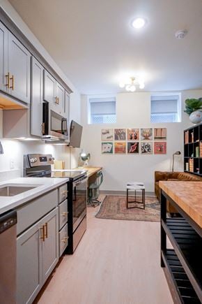 Louisville apartment for rent - Kitchen bar island in 1st floor studio apartment at Myers Medical Lofts