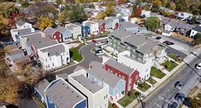 Louisville apartment for rent - A bird's eye view of a residential area with houses and a road.