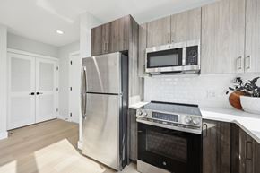 Newark apartment for rent - A modern kitchen with a stainless steel refrigerator and oven.