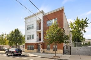 Newark apartment for rent - an apartment building with a car parked in front of it