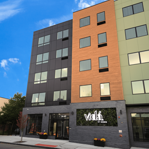 Newark apartment for rent - A tall building with a sign that says "Vidisha" on it.