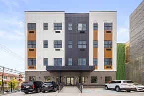 Newark apartment for rent - the front of a building with cars parked in front of it