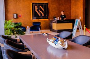 Newark apartment for rent - a table with chairs and a bowl of figurines on it