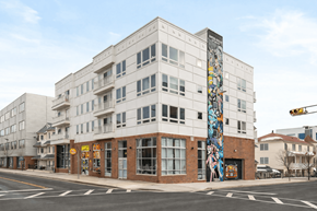 Newark apartment for rent - A street view of a building with a mural on the side.