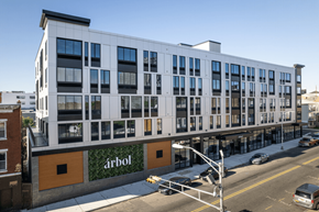 Newark apartment for rent - a large white building with many windows on a city street