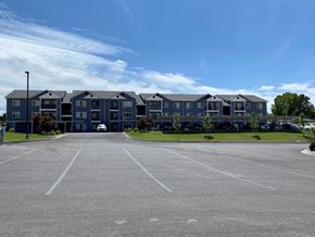 Clarkston apartment for rent - an empty parking lot in front of an apartment building