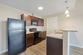 Airway Heights apartment for rent - a kitchen with a refrigerator and a stove and