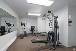 Spokane apartment for rent - a gym with exercise machines and a mirror