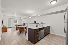Spokane apartment for rent - A modern kitchen with a dining table and chairs.