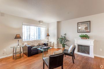 Cda apartment for rent - a living room with a couch and a fireplace