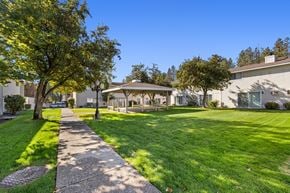Spokane apartment for rent - a gazebo sits in the middle of a grassy area