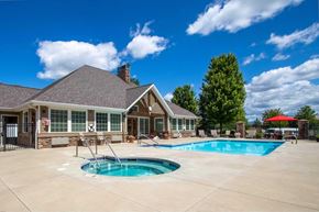 Spokane apartment for rent - A house with a pool in the backyard.