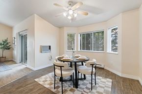 Spokane apartment for rent - A dining room with a table set for two and a ceiling fan.