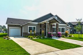 Post Falls apartment for rent - A house with a grey roof and a white garage door.