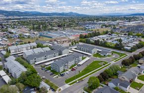 Spokane Valley apartment for rent - A bird's eye view of a residential area with houses, roads, and a parking lot.