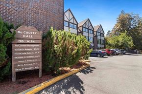 Spokane apartment for rent - A sign in front of a building that says McCAULEY HALL.