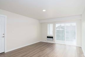 Spokane apartment for rent - A room with a white door and a window with blinds.