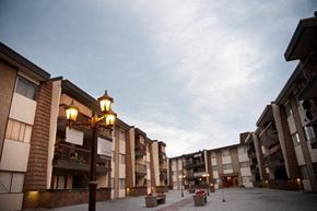 Coquitlam apartment for rent - a row of apartment buildings with street lights