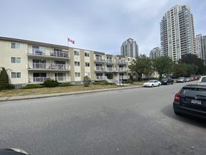 Burnaby apartment for rent - a block of condominiums with a canadian flag flying over them