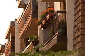 Coquitlam apartment for rent - an apartment building with a balcony full of flowers