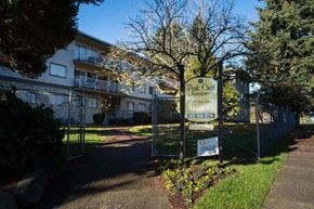 Burnaby apartment for rent - a large building with a sign in front of it