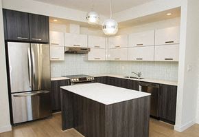 Port Coquitlam apartment for rent - a kitchen with a white counter top and a stainless steel refrigerator