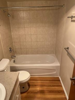 Burnaby apartment for rent - a small bathroom with a toilet and a bathtub
