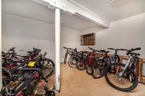 Esquimalt apartment for rent - A room full of bicycles with a white pole in the middle.