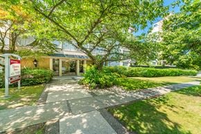 Vancouver apartment for rent - A building entrance with a sign that says "Welcome to Hillcrest Apartments".