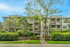 Vancouver apartment for rent - Apartment building with a tree in front of it.