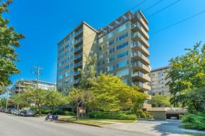 Vancouver apartment for rent - A modern apartment building with a parking lot in front.
