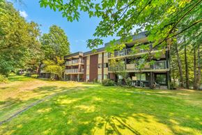 Burnaby apartment for rent - A large grassy area in front of apartment buildings.