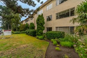 Victoria apartment for rent - A building with a sign that says "Pacific Shores" in front of it.