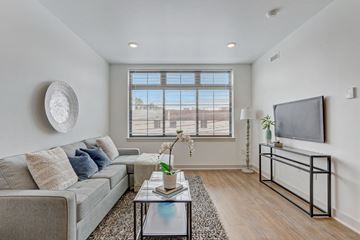 Philadelphia apartment for rent - an apartment living room with a couch and a tv