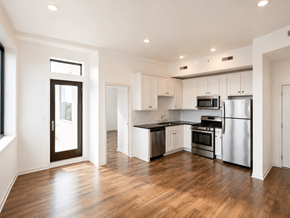 Philadelphia apartment for rent - A modern kitchen with stainless steel appliances and wooden floors.