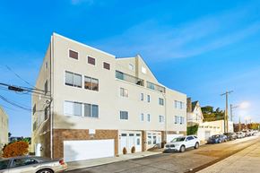 Philadelphia apartment for rent - an apartment building on a city street with parked cars