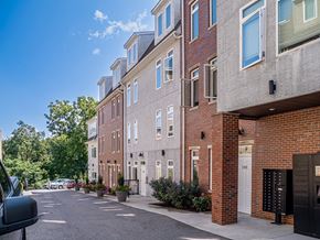 Philadelphia apartment for rent - a brick building with a parking lot in front of it