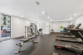 Philadelphia apartment for rent - A gym with treadmills, weights, and exercise balls.