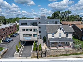 Philadelphia apartment for rent - an aerial view of a building and a house on a street