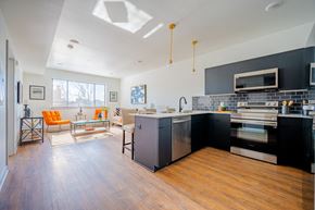 Philadelphia apartment for rent - A kitchen with a black counter top and stainless steel appliances.