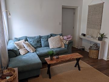 Philadelphia apartment for rent - a living room with a blue couch and a coffee table