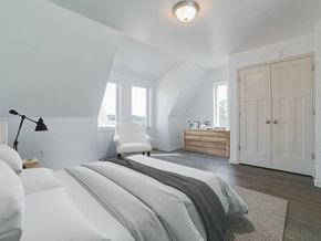 Philadelphia apartment for rent - a white bedroom with a bed and a white door