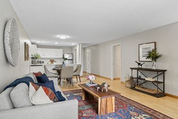 Redmond condo for rent - A living room with a grey couch and a coffee table.