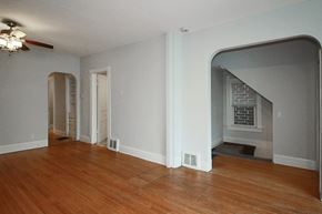 Chicago apartment for rent - an empty living room with a hard wood floor and a fireplace