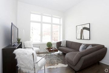 Chicago apartment for rent - a living room with a couch and a chair