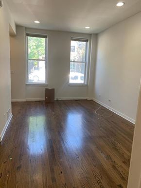 Chicago apartment for rent - a living room with a hard wood floor and two windows