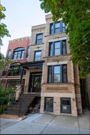 Chicago apartment for rent - the front of a brick building with stairs and