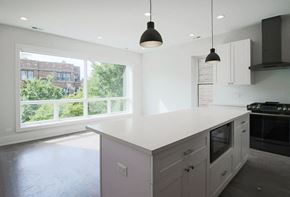Chicago apartment for rent - a large white kitchen with a large window