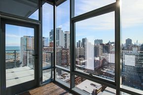 Chicago apartment for rent - the view of the city from the living room of a condo with large windows
